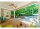 Spacious covered patio with comfortable seating and scenic views of the backyard and pool area at 4319 Sailview Dr, Denver, NC 28037