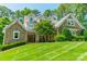 Beautiful stone-clad home featuring well-manicured lawn and inviting curb appeal at 4319 Sailview Dr, Denver, NC 28037