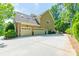 Three car garage with an additional basketball court perfect for parking and recreational activities at 4319 Sailview Dr, Denver, NC 28037