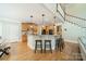 Spacious kitchen with wood floors, large island, granite countertops and stainless appliances at 4319 Sailview Dr, Denver, NC 28037