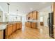 Bright kitchen with wood floors, wood cabinets, granite countertops and stainless steel appliances at 4319 Sailview Dr, Denver, NC 28037