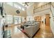 Bright living room featuring a fireplace, built-ins, and hardwood floors at 4319 Sailview Dr, Denver, NC 28037