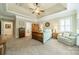 Spacious main bedroom with tray ceiling, carpet floors, sitting area and ensuite bath at 4319 Sailview Dr, Denver, NC 28037