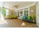 Relaxing covered porch featuring ample seating, a ceiling fan, and views of the outdoor area at 4319 Sailview Dr, Denver, NC 28037