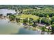 Aerial view of a lakefront property with a private dock on a sunny day at 4920 Longfield St, Claremont, NC 28610