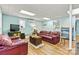 Finished basement living space featuring laminate floors, a TV, and comfortable seating at 4920 Longfield St, Claremont, NC 28610