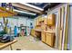 Basement workspace featuring a workbench, storage cabinets, and utility hookups at 4920 Longfield St, Claremont, NC 28610