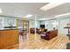 Spacious finished basement featuring wood floors, lounge area, and walk-out to the outdoors at 4920 Longfield St, Claremont, NC 28610