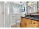 Bathroom featuring a decorative mirror, granite counters, and tile floors at 4920 Longfield St, Claremont, NC 28610