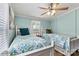 Inviting bedroom featuring two twin beds, and serene coastal decor at 4920 Longfield St, Claremont, NC 28610