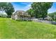 Two-story lake house with a charming double deck and a vibrant green lawn at 4920 Longfield St, Claremont, NC 28610