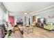 Spacious living room with hardwood floors, comfortable seating, and a view to the kitchen at 4920 Longfield St, Claremont, NC 28610