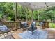Covered back porch with comfortable seating, perfect for outdoor relaxation at 511 Apple Ln, Bessemer City, NC 28016