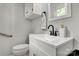 Well-lit half bathroom featuring modern fixtures and neutral paint at 511 Apple Ln, Bessemer City, NC 28016