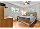 Bright bedroom boasts hardwood floors, natural light and a ceiling fan at 511 Apple Ln, Bessemer City, NC 28016