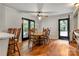 Dining area featuring hardwood floors, with black French doors, and outdoor access at 511 Apple Ln, Bessemer City, NC 28016