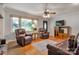 Cozy living room with hardwood floors, comfortable seating, and bright natural light at 511 Apple Ln, Bessemer City, NC 28016