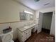 Bathroom with double vanity and mirrors at 511 Evelyn Ave, Kannapolis, NC 28083