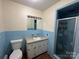 Bathroom featuring a single sink vanity and a standing shower at 511 Evelyn Ave, Kannapolis, NC 28083