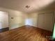 Bedroom features hardwood floors, closet space, and bright lighting at 511 Evelyn Ave, Kannapolis, NC 28083