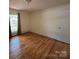 Bright bedroom featuring hardwood floors and window at 511 Evelyn Ave, Kannapolis, NC 28083