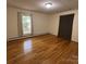 Spacious bedroom featuring hardwood floors and natural light from a window at 511 Evelyn Ave, Kannapolis, NC 28083