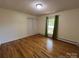 Bedroom with hardwood floors, natural light, and closet at 511 Evelyn Ave, Kannapolis, NC 28083