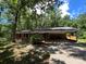Charming brick home with attached carport nestled among mature trees at 511 Evelyn Ave, Kannapolis, NC 28083