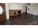 Comfortable living room with hardwood floors, a brick fireplace, and a front door view at 511 Evelyn Ave, Kannapolis, NC 28083