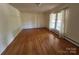 Comfortable living room featuring hardwood floors and a bright window view at 511 Evelyn Ave, Kannapolis, NC 28083