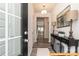 Welcoming entryway featuring a decorative console table and luxury vinyl flooring at 6024 Jasmine Branch Rd, Charlotte, NC 28216
