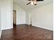 This bedroom features spacious layout with neutral-toned walls and wood-look floors at 710 Woodington Ln, Charlotte, NC 28214