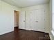 This bedroom offers ample closet space and new flooring at 710 Woodington Ln, Charlotte, NC 28214