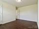 Spacious bedroom with hardwood floors, neutral walls, and a standard closet at 710 Woodington Ln, Charlotte, NC 28214