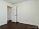 Bedroom with hardwood floors, neutral walls, and two standard closets at 710 Woodington Ln, Charlotte, NC 28214