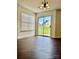 Bright dining area features sliding glass doors to backyard and hardwood floors at 710 Woodington Ln, Charlotte, NC 28214