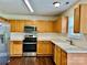 Well-equipped kitchen featuring stainless steel appliances and wooden cabinets at 710 Woodington Ln, Charlotte, NC 28214