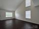 Spacious living area featuring a vaulted ceiling and large window at 710 Woodington Ln, Charlotte, NC 28214