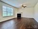 Spacious living room features a window for natural light and a cozy fireplace at 710 Woodington Ln, Charlotte, NC 28214
