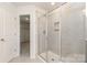 Bathroom featuring a glass enclosed shower and linen closet at 724 Little Bluestem Dr, Lake Wylie, SC 29710