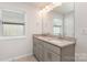 Bathroom featuring double vanity with granite countertop and large mirror at 724 Little Bluestem Dr, Lake Wylie, SC 29710