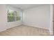 Neutral bedroom featuring a large window at 724 Little Bluestem Dr, Lake Wylie, SC 29710