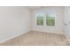 Bedroom featuring two windows and closet at 724 Little Bluestem Dr, Lake Wylie, SC 29710