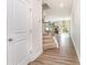 Inviting entryway with hardwood floors, staircase, and view into the living area at 724 Little Bluestem Dr, Lake Wylie, SC 29710