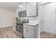 Well-equipped kitchen with stainless appliances, modern cabinetry, and white countertops at 724 Little Bluestem Dr, Lake Wylie, SC 29710