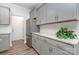 Bright kitchen with stainless steel refrigerator, white subway tile, and granite counters at 724 Little Bluestem Dr, Lake Wylie, SC 29710