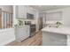 Modern kitchen with stainless steel appliances, white cabinetry, and granite countertops at 724 Little Bluestem Dr, Lake Wylie, SC 29710