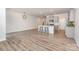 Spacious living room flowing into the kitchen featuring hardwood floors at 724 Little Bluestem Dr, Lake Wylie, SC 29710
