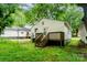 Home exterior with wooden deck and grassy yard at 730 Marble St, Charlotte, NC 28208
