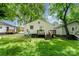 Backyard with trees and lush greenery and wooden deck at 730 Marble St, Charlotte, NC 28208